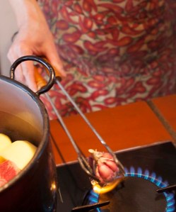 This is a trick I learnt from the local cooks - only they would drop it into a white chicken broth - it adds a subtle smokey taste to the garlic. 